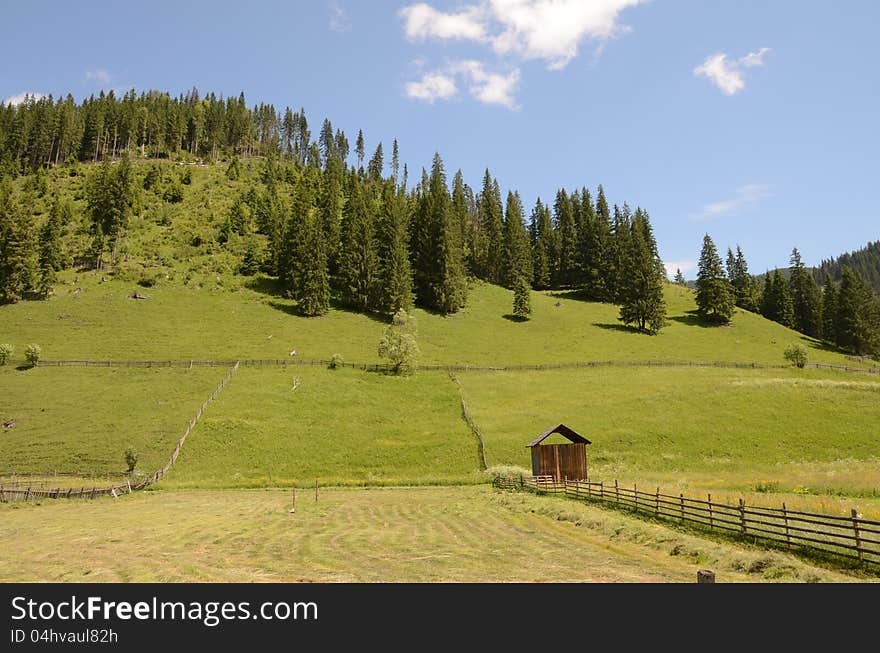 Mountain cottage in the middle of the forest on high mountain in Maramures land of Romania. Mountain cottage in the middle of the forest on high mountain in Maramures land of Romania