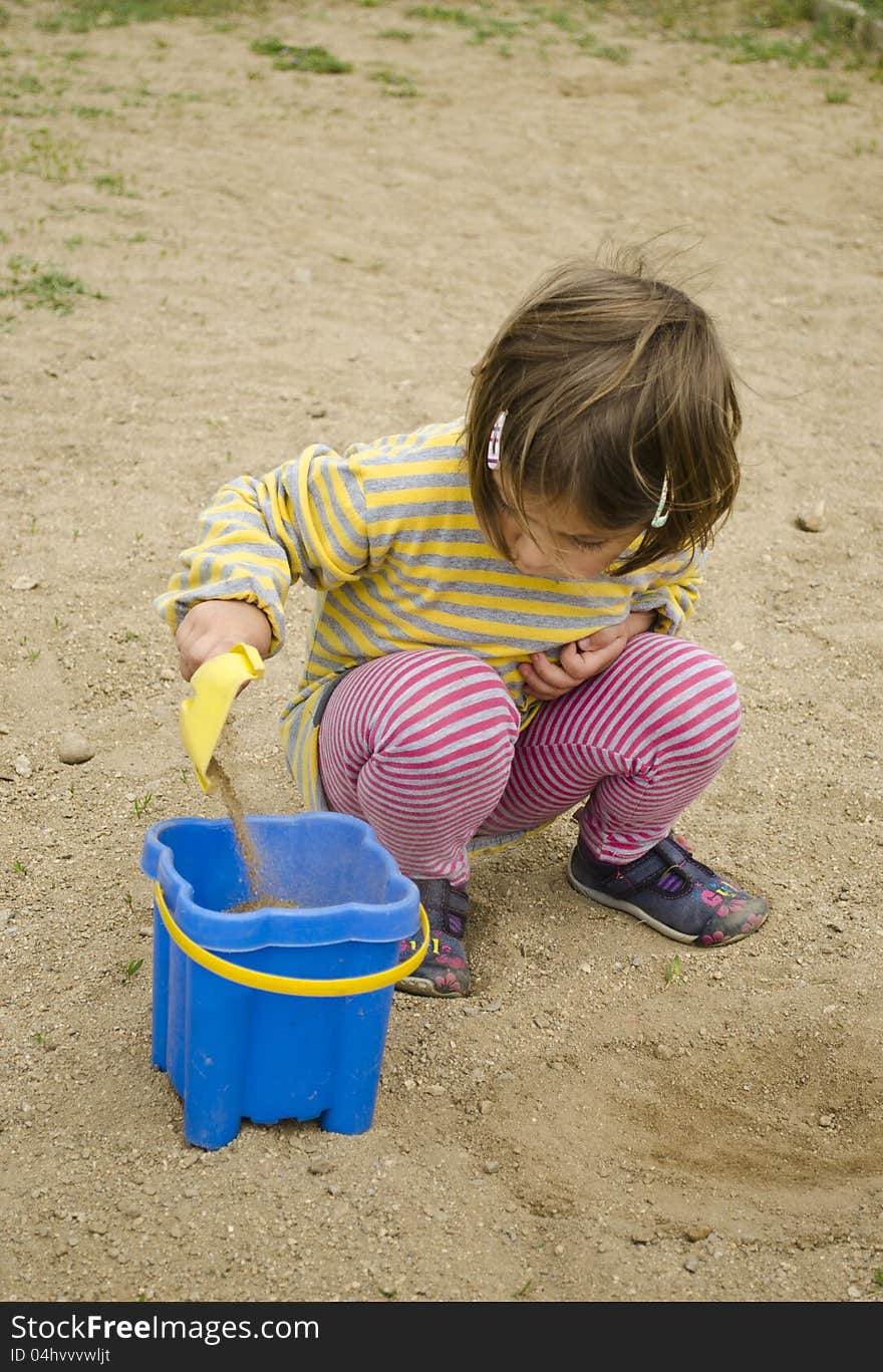 Child playing in the sand