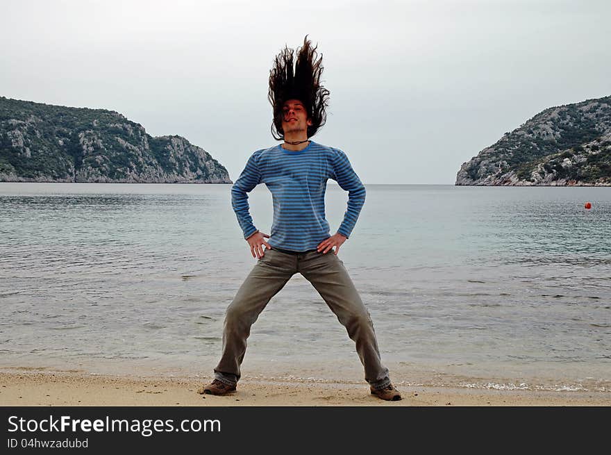 Man With Long Hair On The Beach