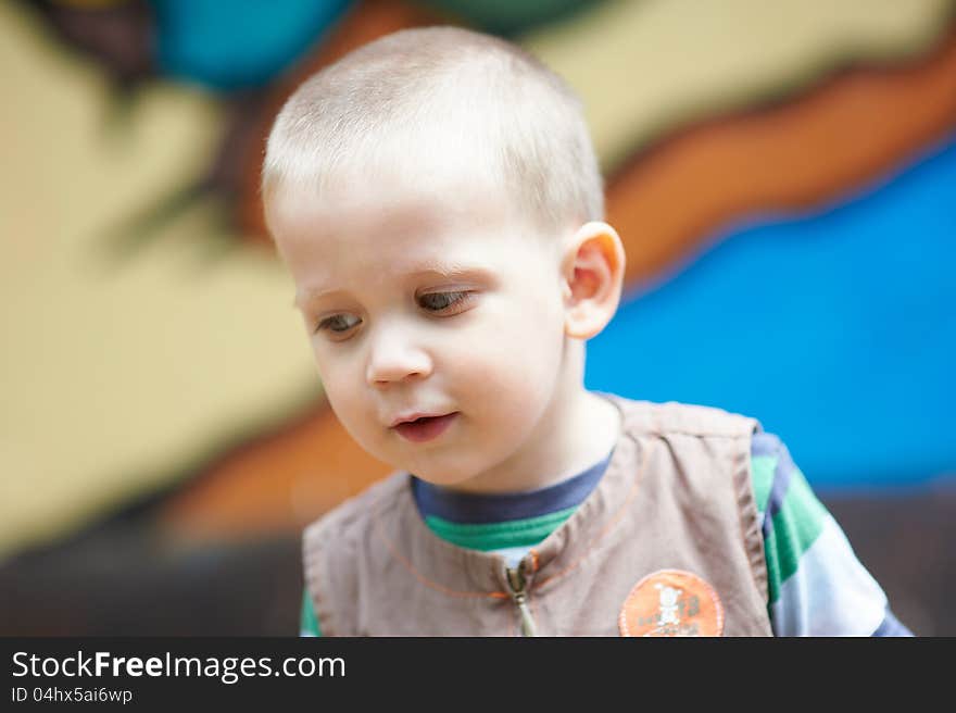 Kid on a colored background closeup