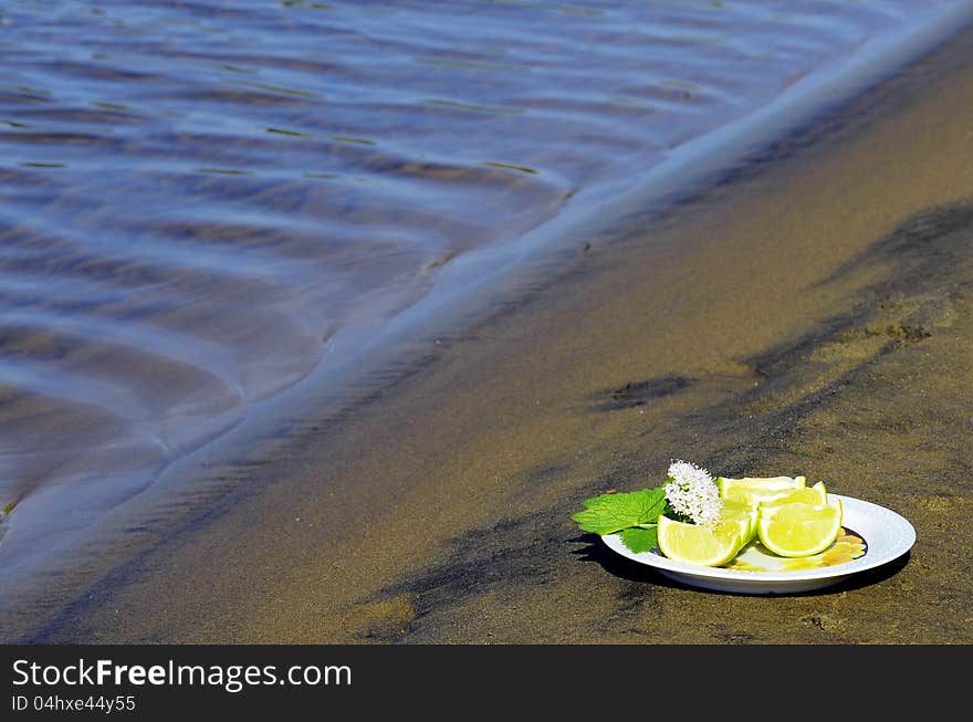 Lime Wedges on a plate at the beach