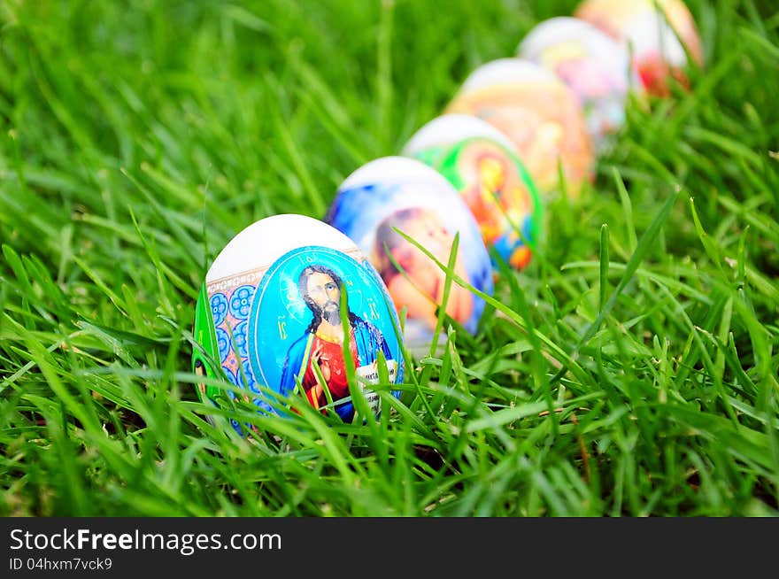 Colorful decorated easter eggs on grass