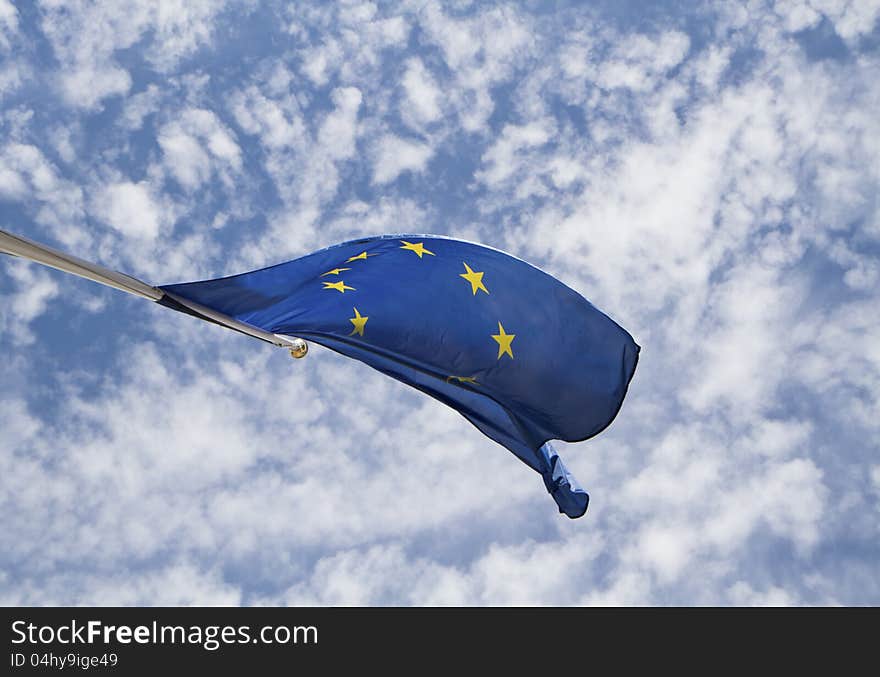 Flag of the european union in front of the deep blue sky