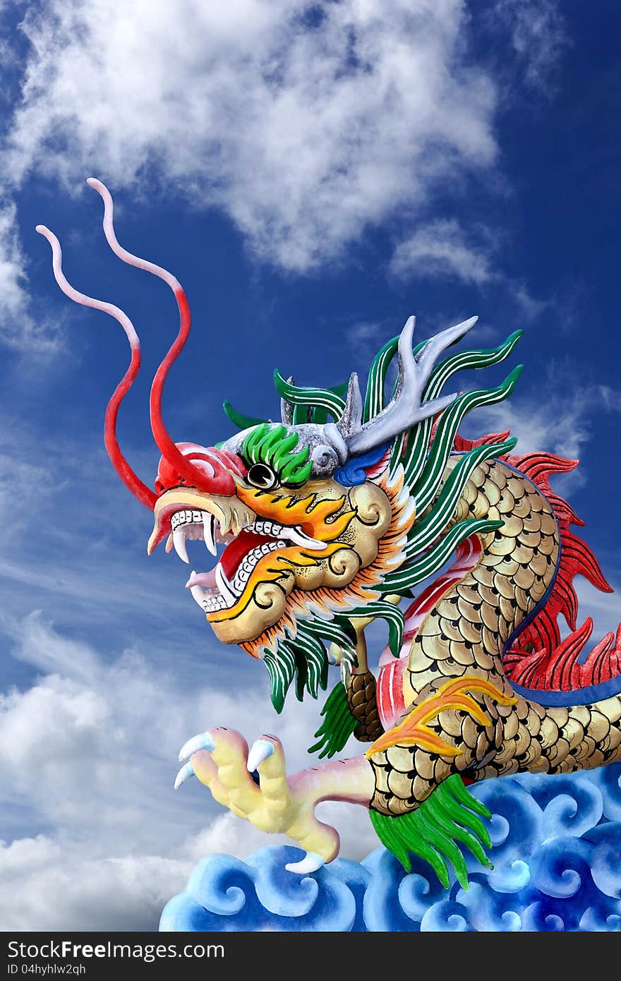 Golden Dragon Statue In  Blue Sky