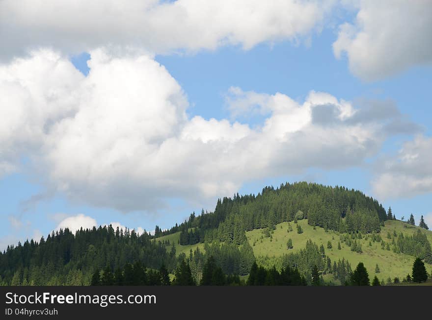 Wooden fence on the hill under cloudy sky. Wooden fence on the hill under cloudy sky