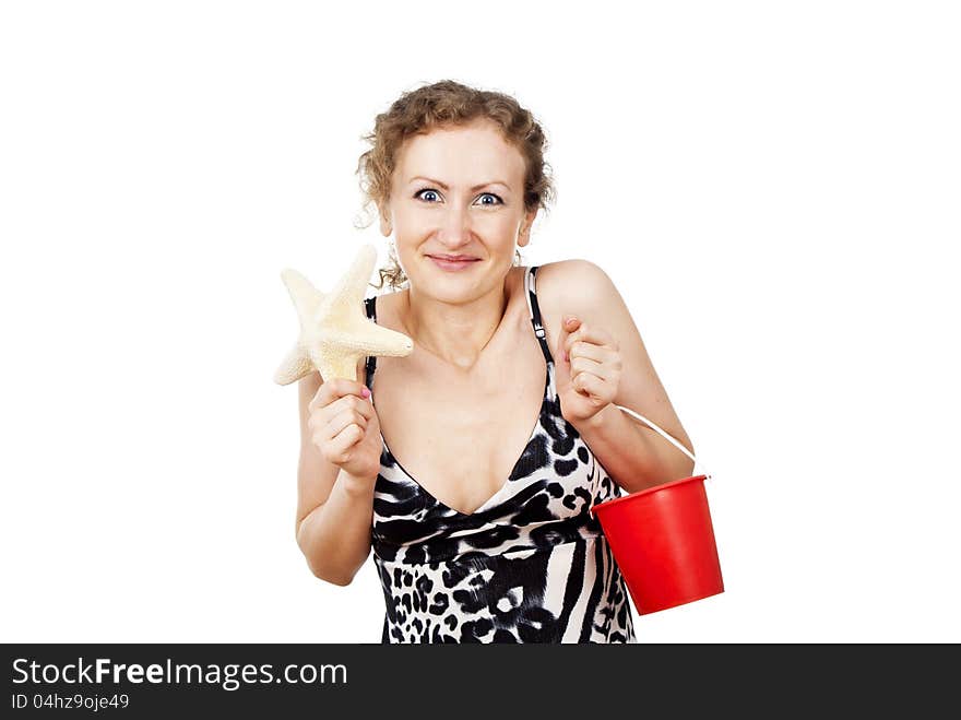 Happy girl with the starfish and bucket