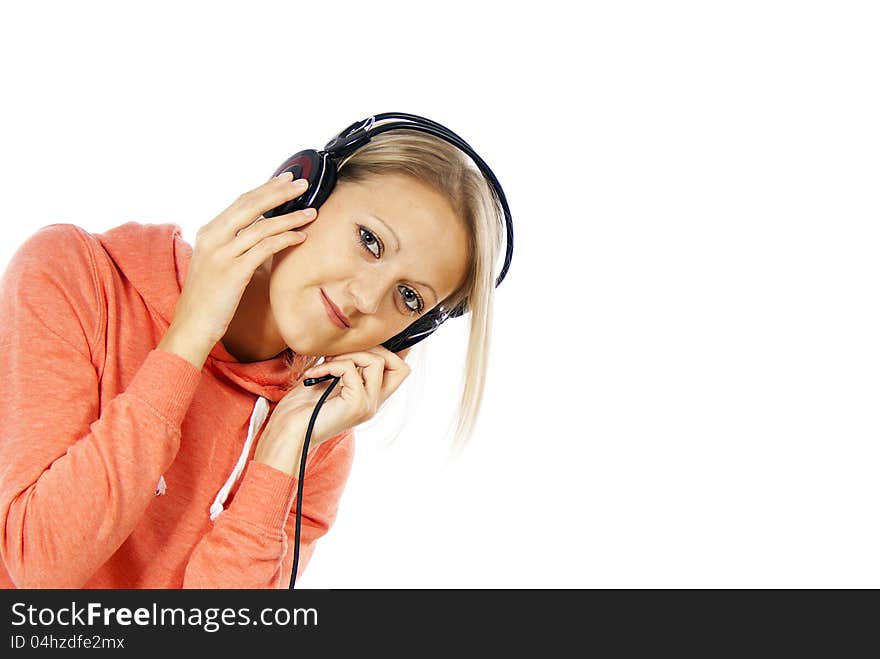 Girl listening to music on headphones and looks