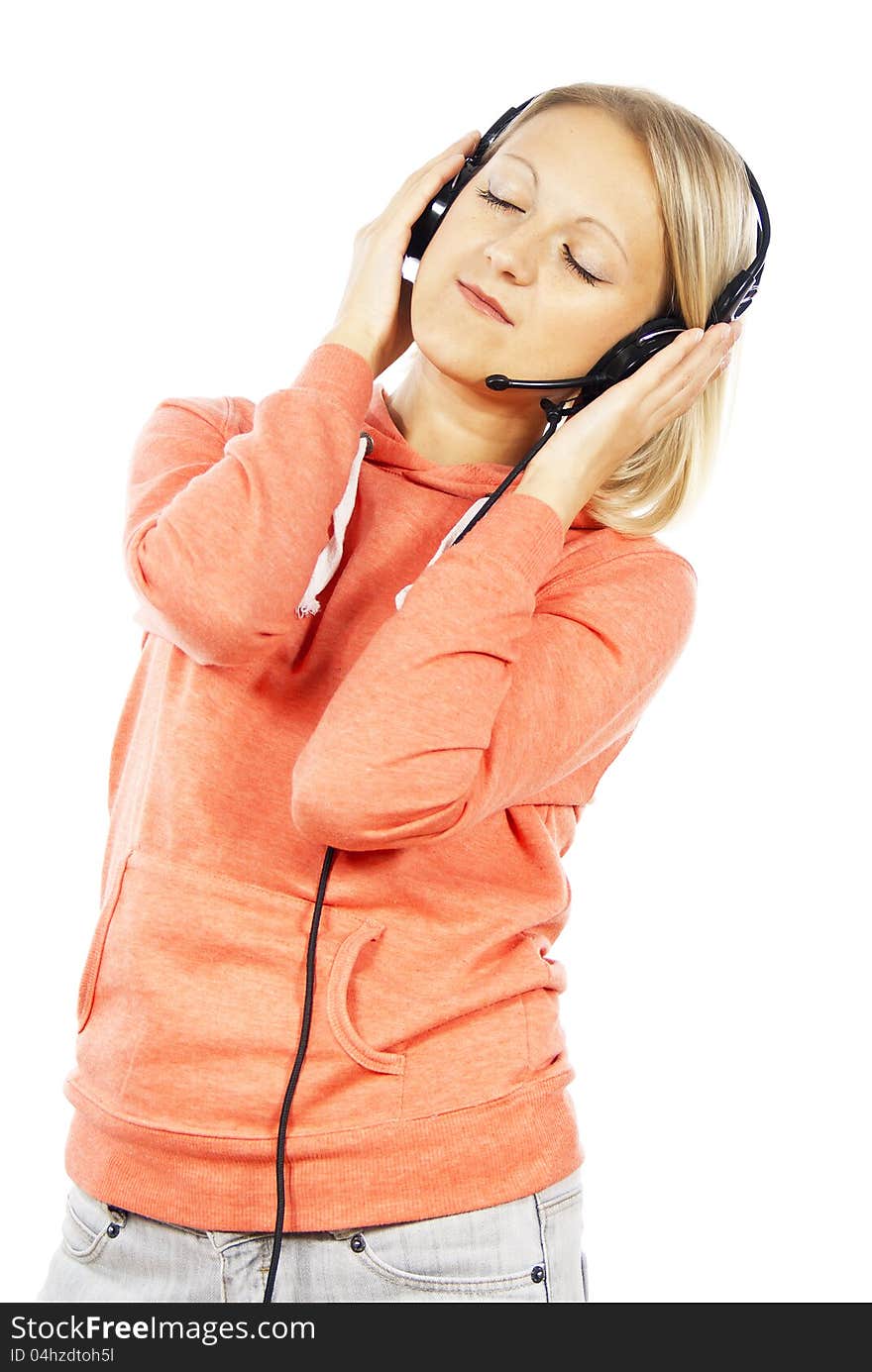 Girl listening to music with headphones isolated. Girl listening to music with headphones isolated