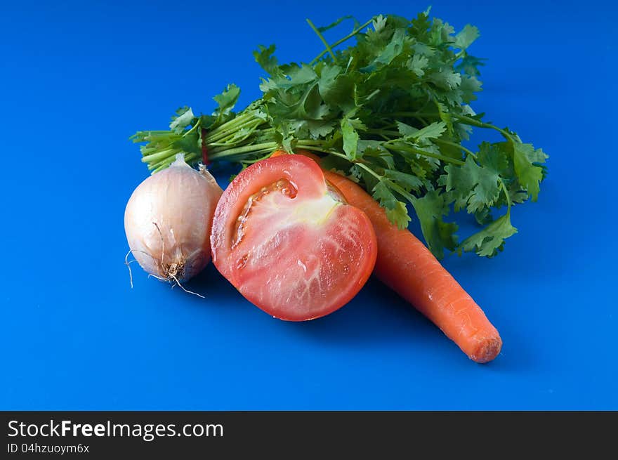 Vegetarian vegetable soup set of carrots, onions, tomatoes and herbs. Vegetarian vegetable soup set of carrots, onions, tomatoes and herbs