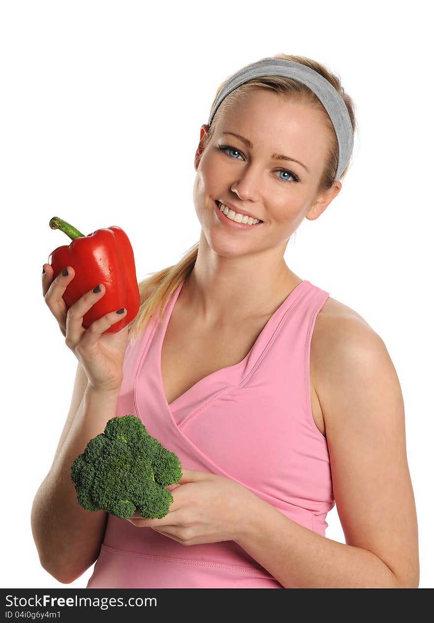 Young Woman holding a red pepper and broccoli isolated on a white background