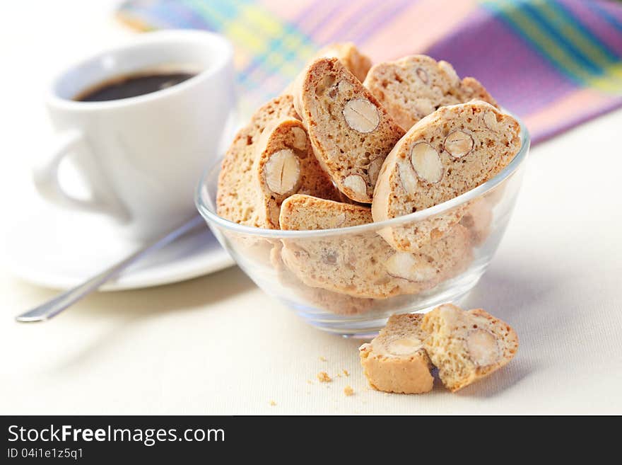 Cantucci cakes and cup of coffee on background. Cantucci cakes and cup of coffee on background