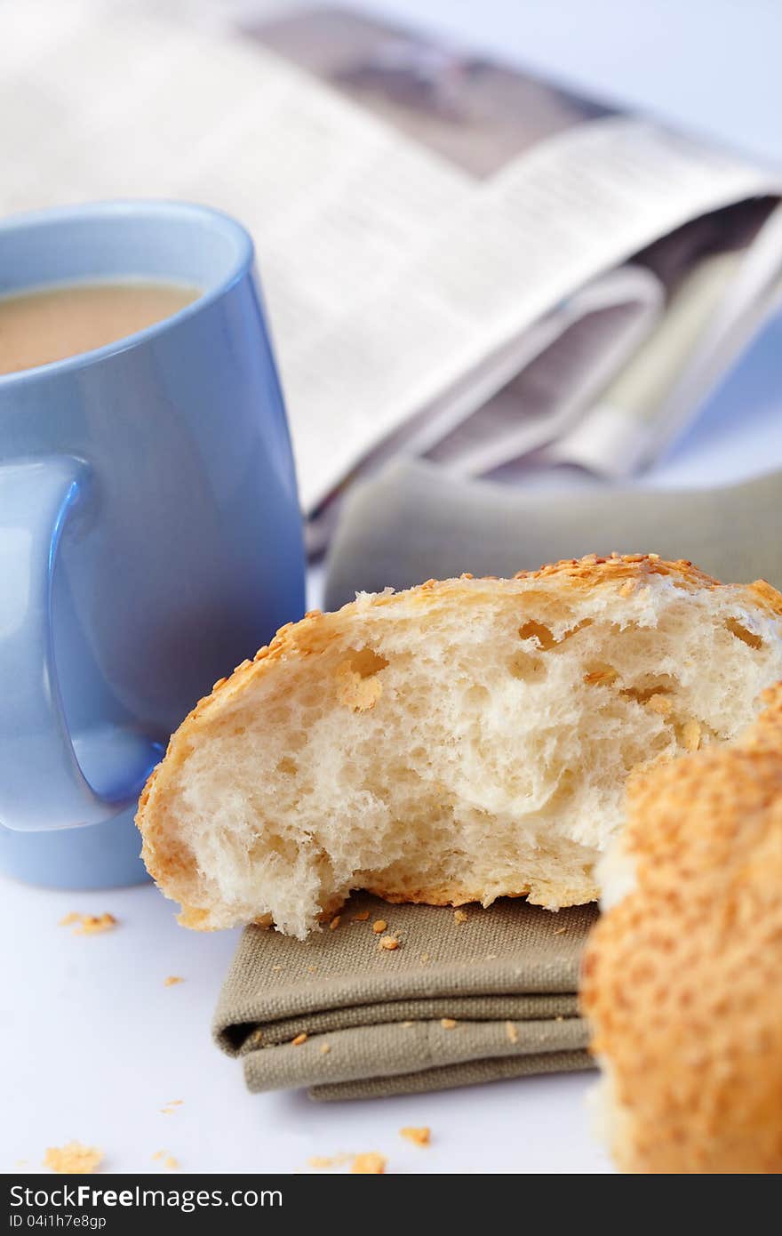 Portion loaf with sesame and coffee on background. Portion loaf with sesame and coffee on background