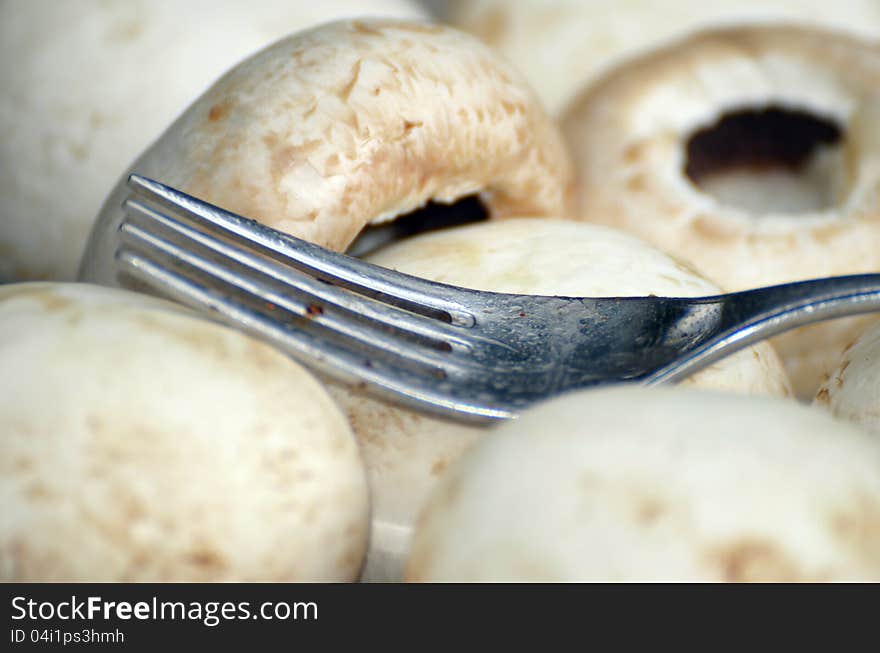 Mushrooms on a plate with a fork