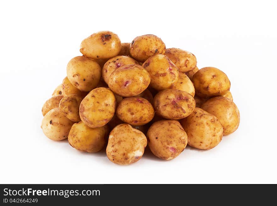 Bunch of potatoes on white background close up shoot