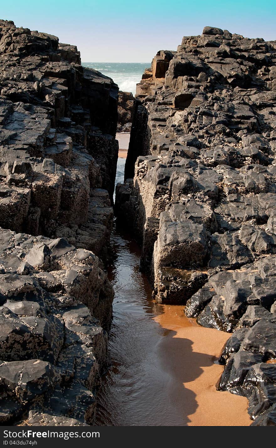 A cleft in the rock formation on the coast at Ballito, KwaZulu-Natal North Coast, South Africa. A cleft in the rock formation on the coast at Ballito, KwaZulu-Natal North Coast, South Africa.