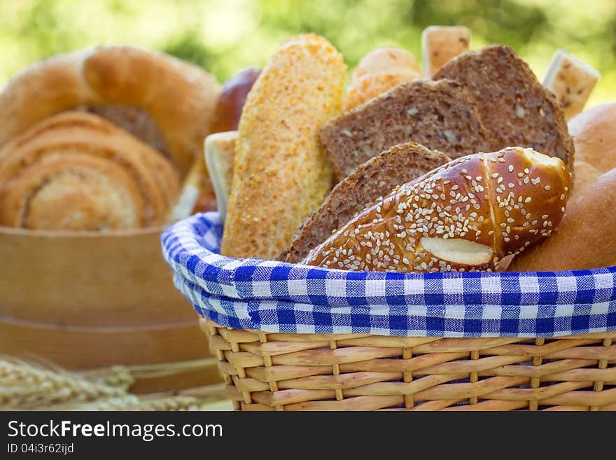 Bread and various pastries in a wicker basket. Bread and various pastries in a wicker basket