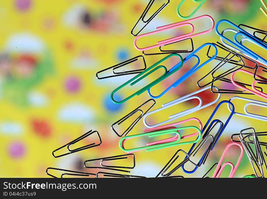 Colorful paper clips on the desk Transparent