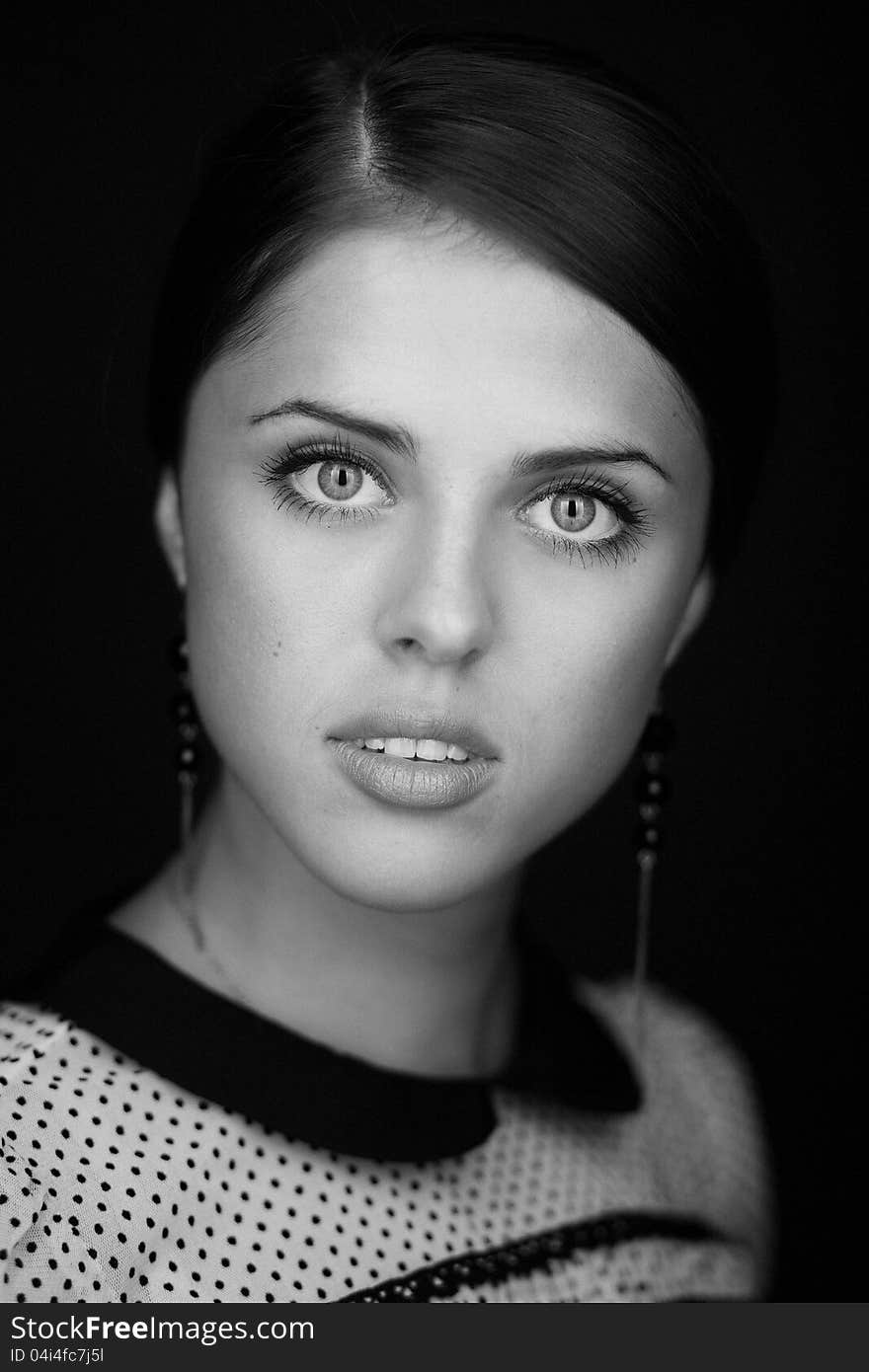 Black and white portrait of beautiful woman  on black background