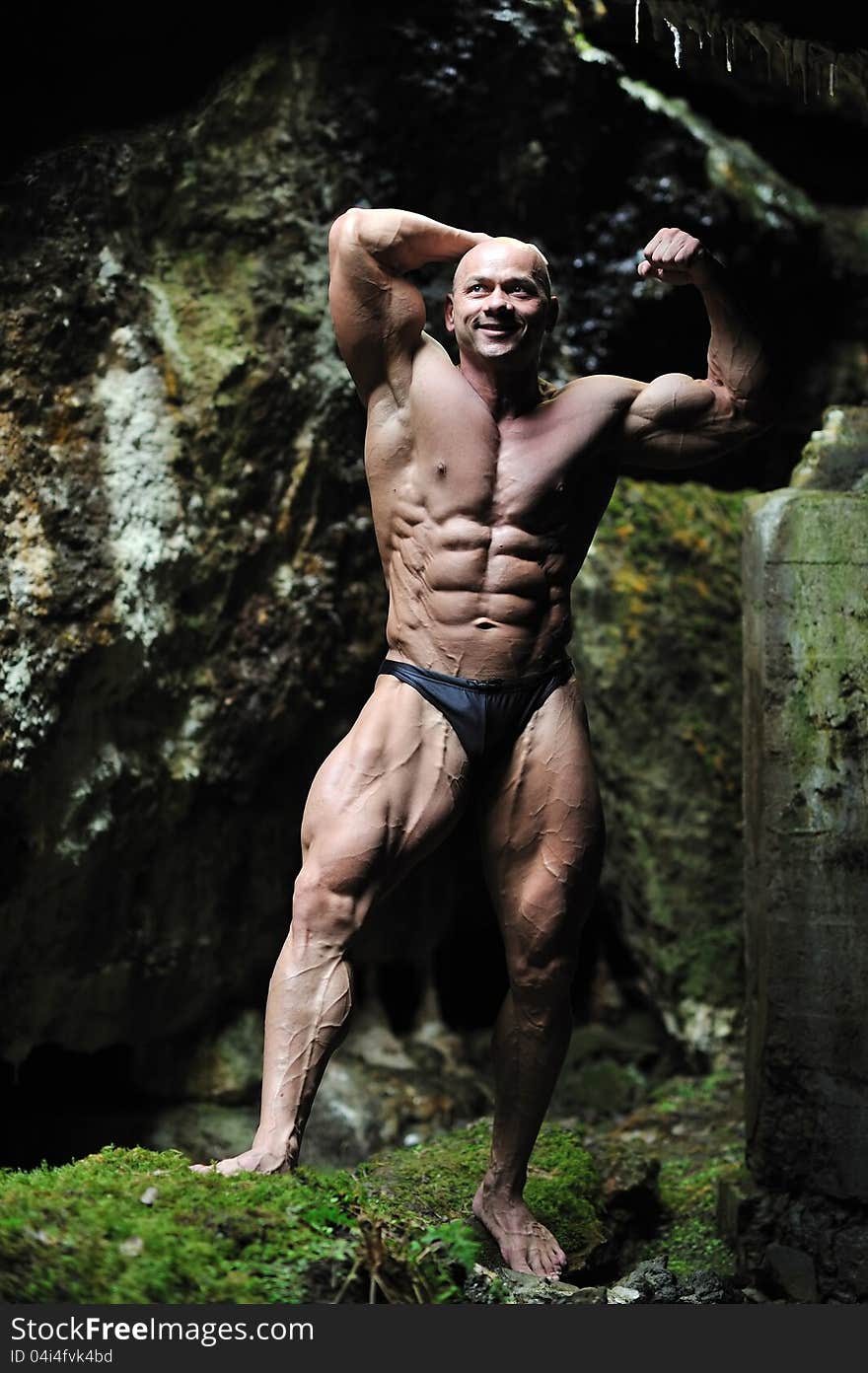 Young Bodybuilder Posing In A Cave