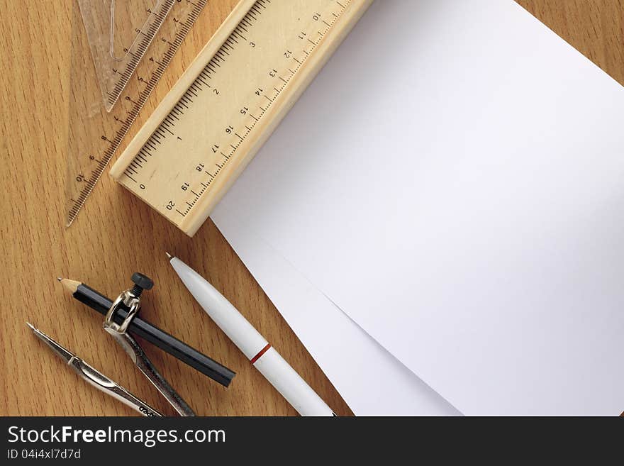 Paper note with a group of accessory on wooden background