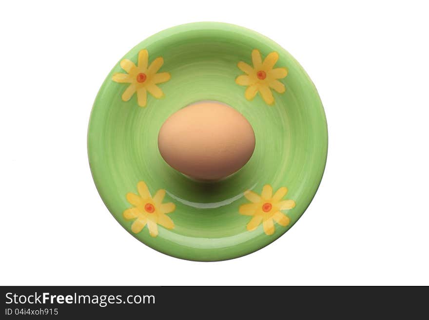 Egg on ceramic plate isolated on white. Egg on ceramic plate isolated on white