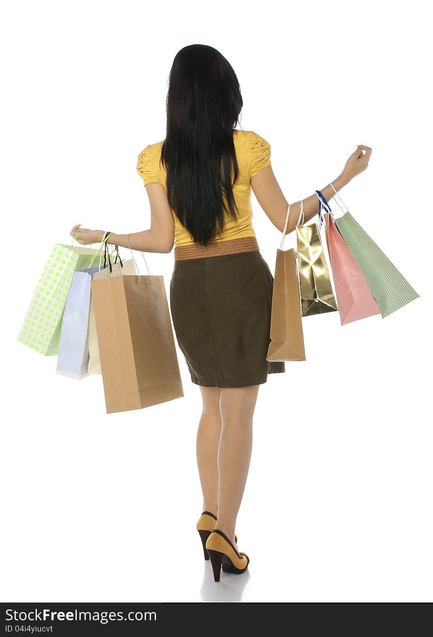 Full body shoot from back asian woman hold shopping bags isolated over white body. Full body shoot from back asian woman hold shopping bags isolated over white body