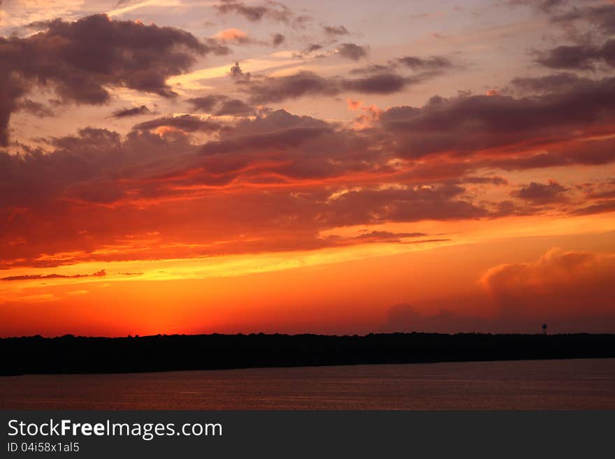 Setting sun illuminates a deck of mid level clouds. Setting sun illuminates a deck of mid level clouds.