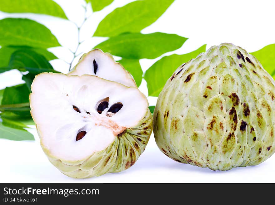 Fresh custard apple and leaf on white background