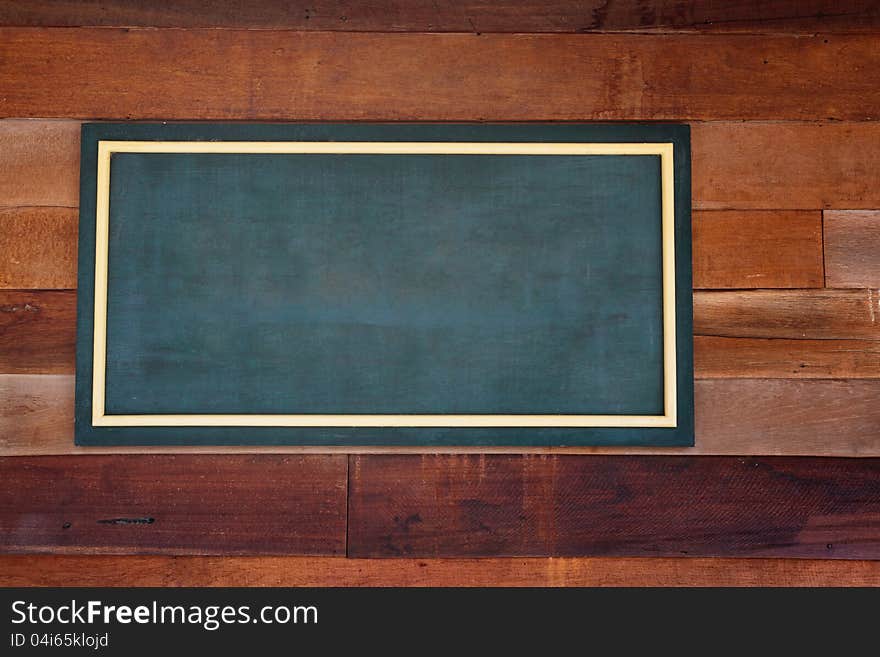 Closeup wooden background with chalkboard