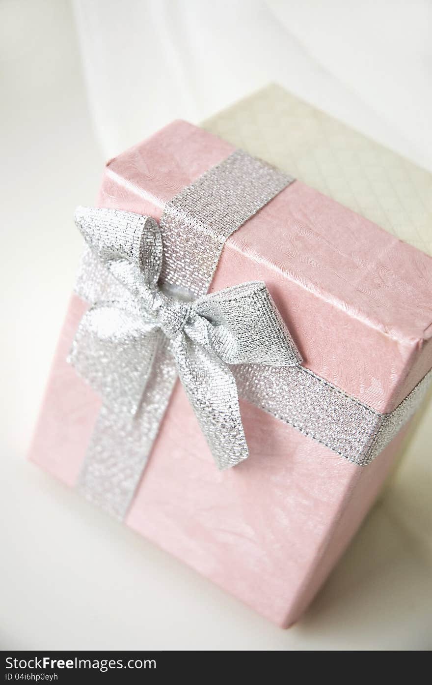 Pink gift box on white background