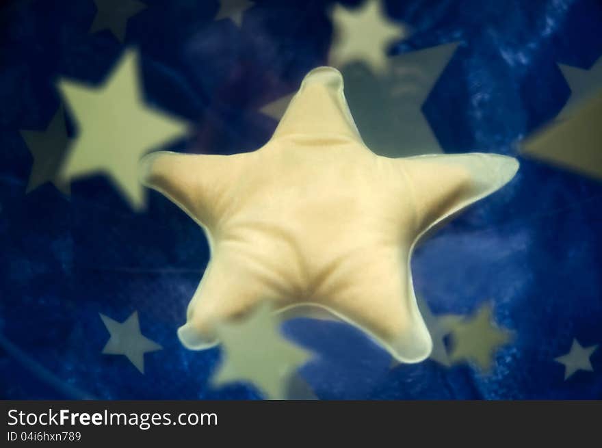 Yellow stars in plastic ball