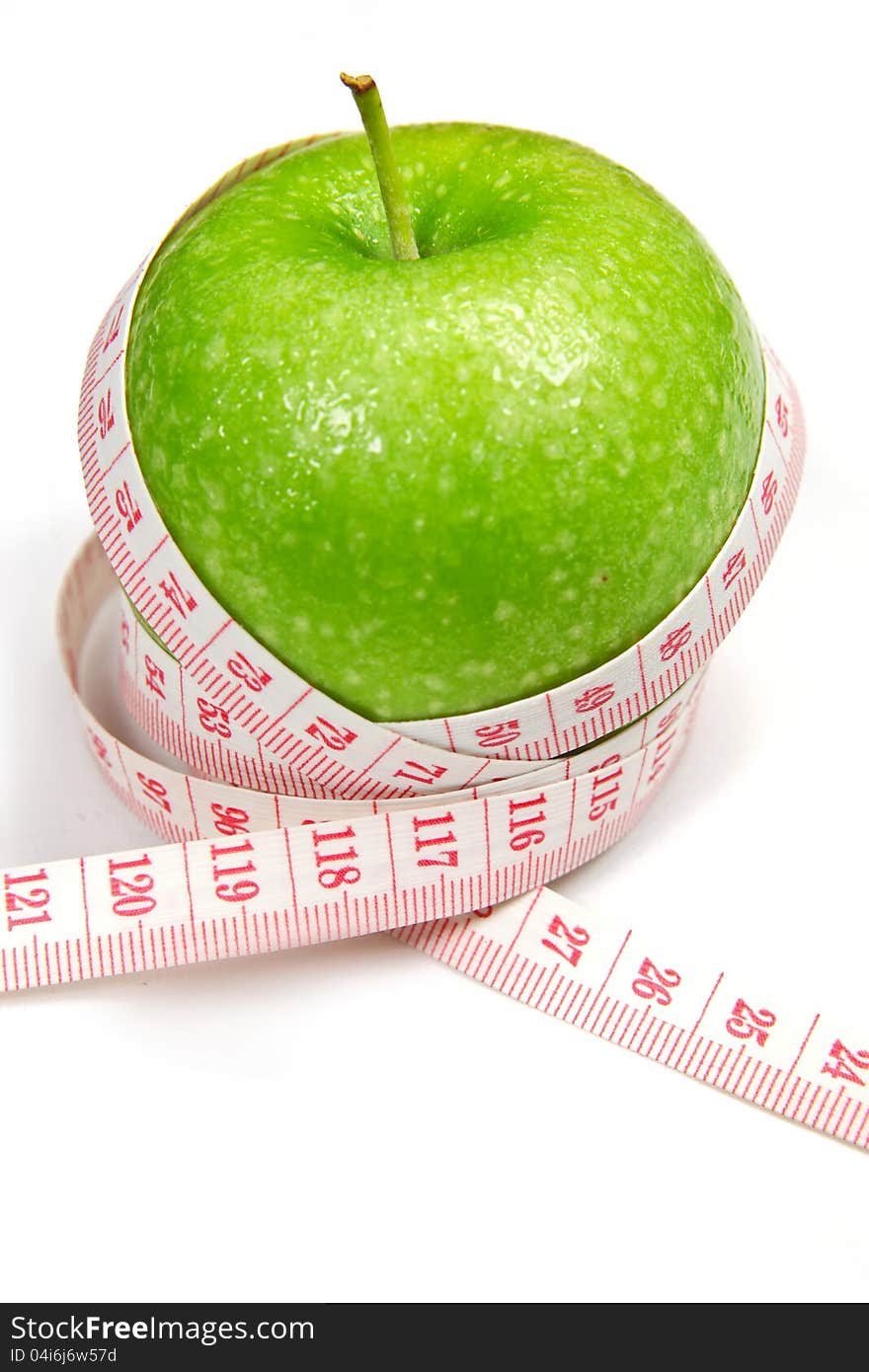 Green apple with measurement on white