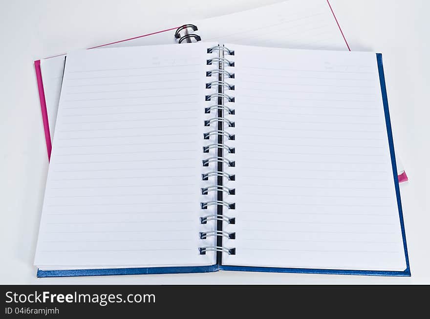 Open blank notebook on a white background ready for writing