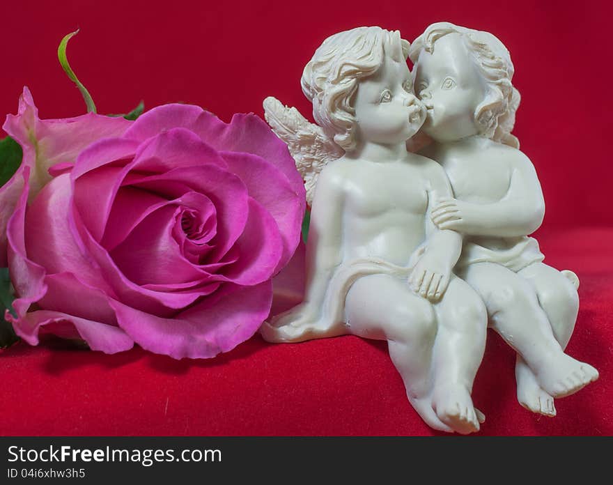 Angels kissing and pink rose