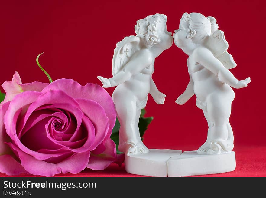 Angels kissing and pink rose