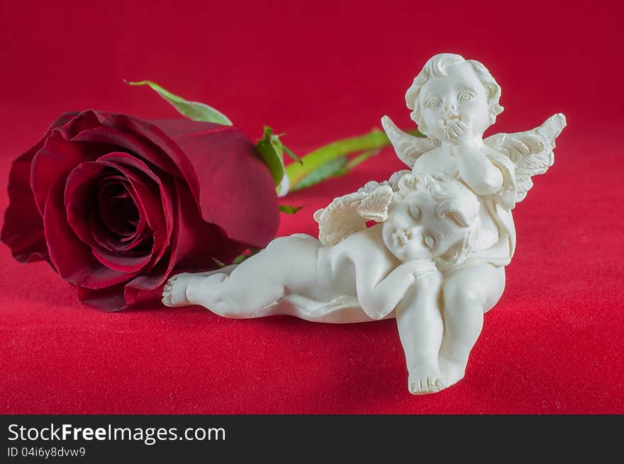 Angels with red rose