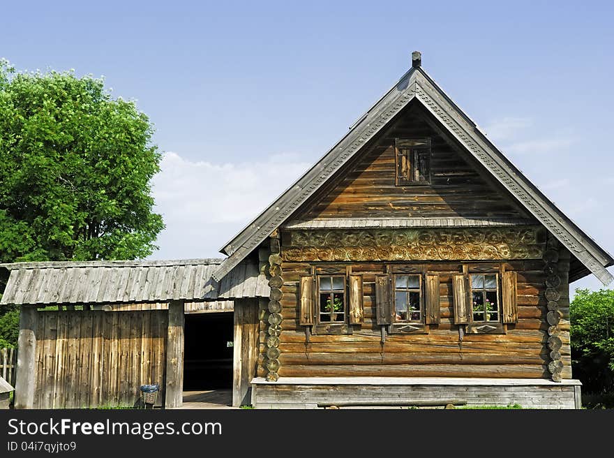 Village house with a small yard.