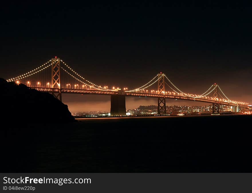 View of the Oakland-San Francisco Bay bridge at night from Treasure island