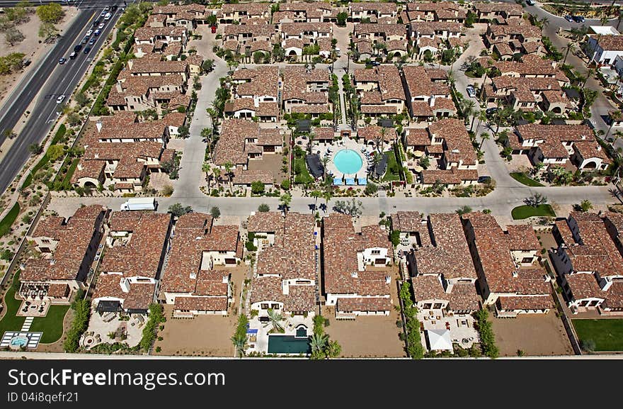 Red Tile rooftops and swimming pool overhead view