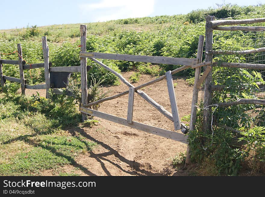 One old wooden fence in the wild countryside