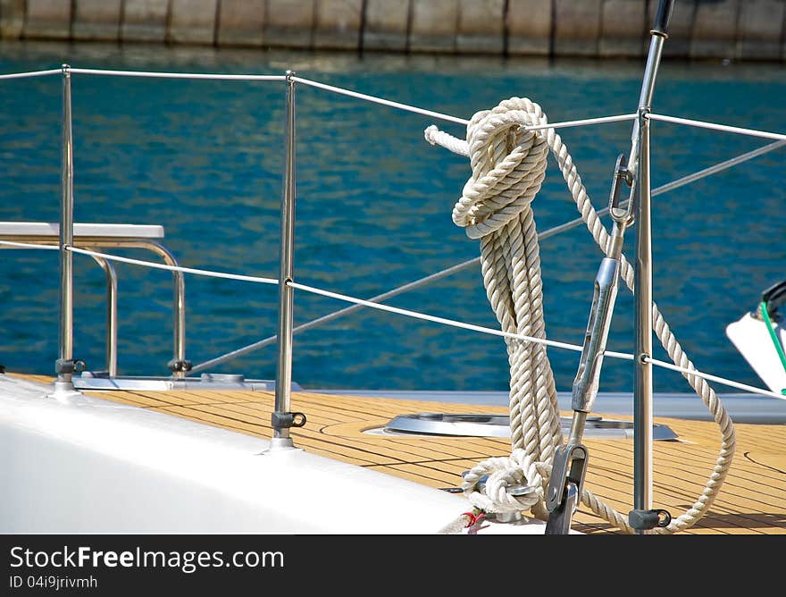 Ropes and knots of sailboat. Tackles on the rigging yacht.