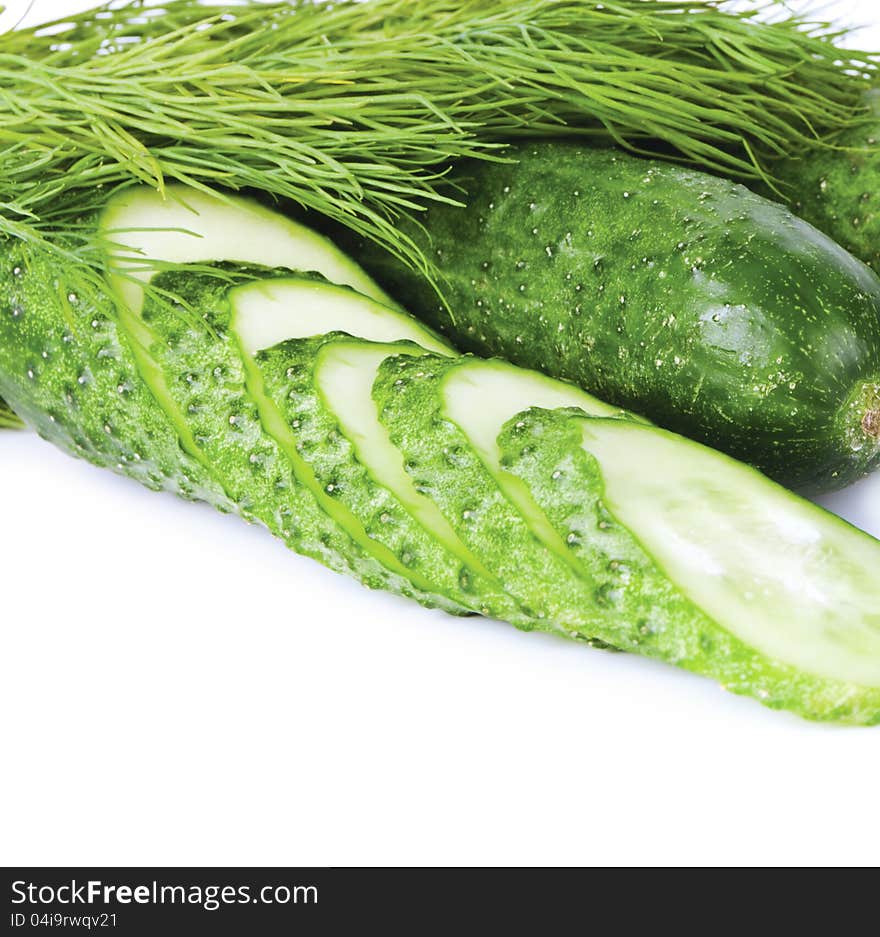 Cucumbers and clove of cucumber, dill on a white background