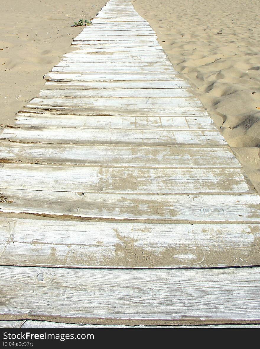 Plank deck path in sand beach. Plank deck path in sand beach