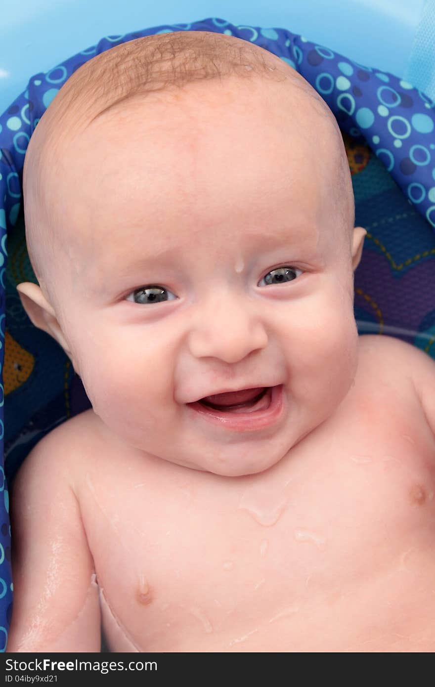 Baby boy having bubble bath for the first time, photo taken at his 5 months.