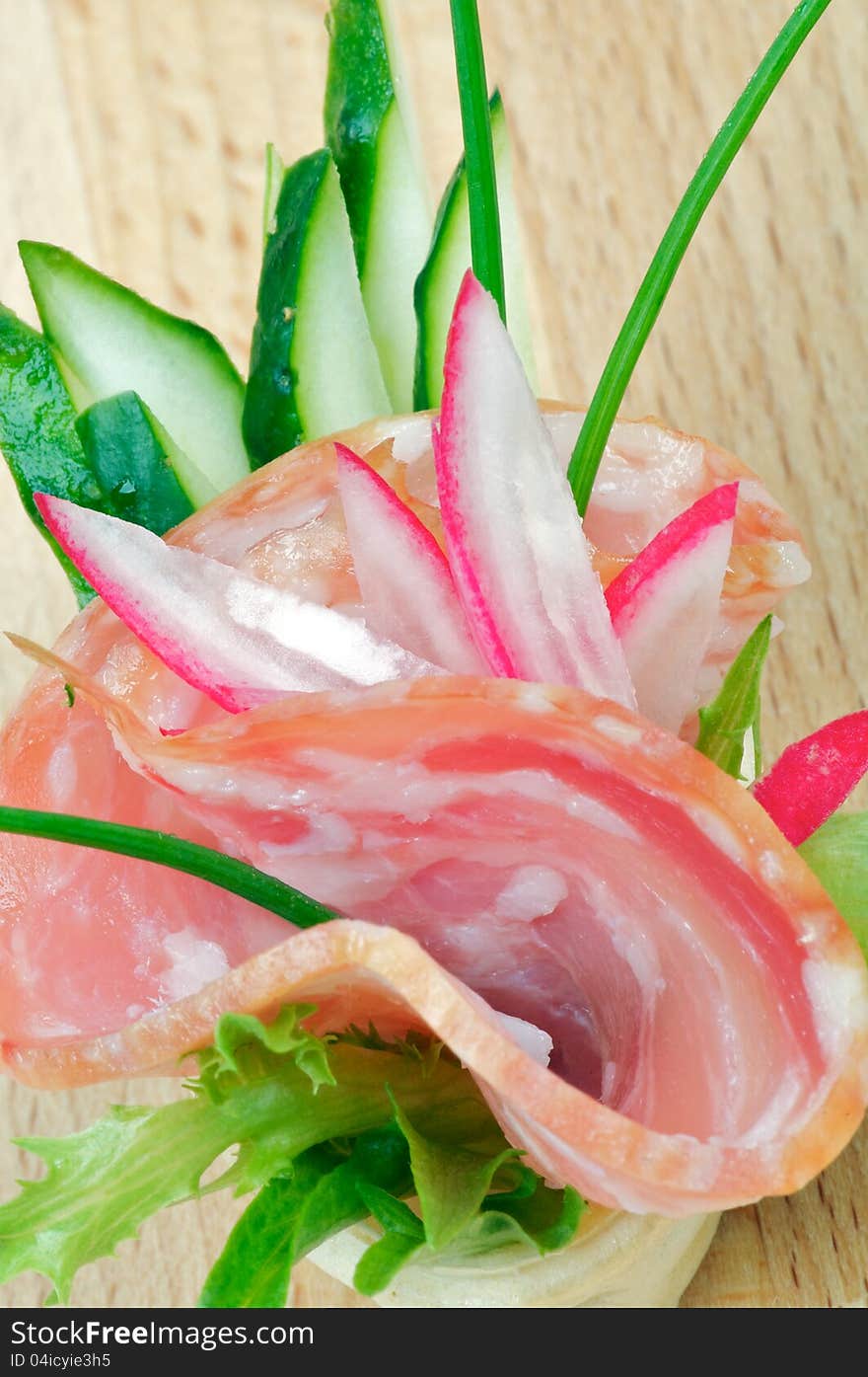 Appetizer of Salchichon, Cucucmber and Radish closeup