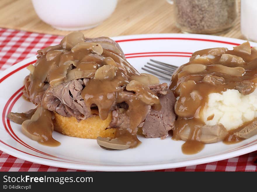 Roast beef and mashed potatoes with mushroom gravy. Roast beef and mashed potatoes with mushroom gravy