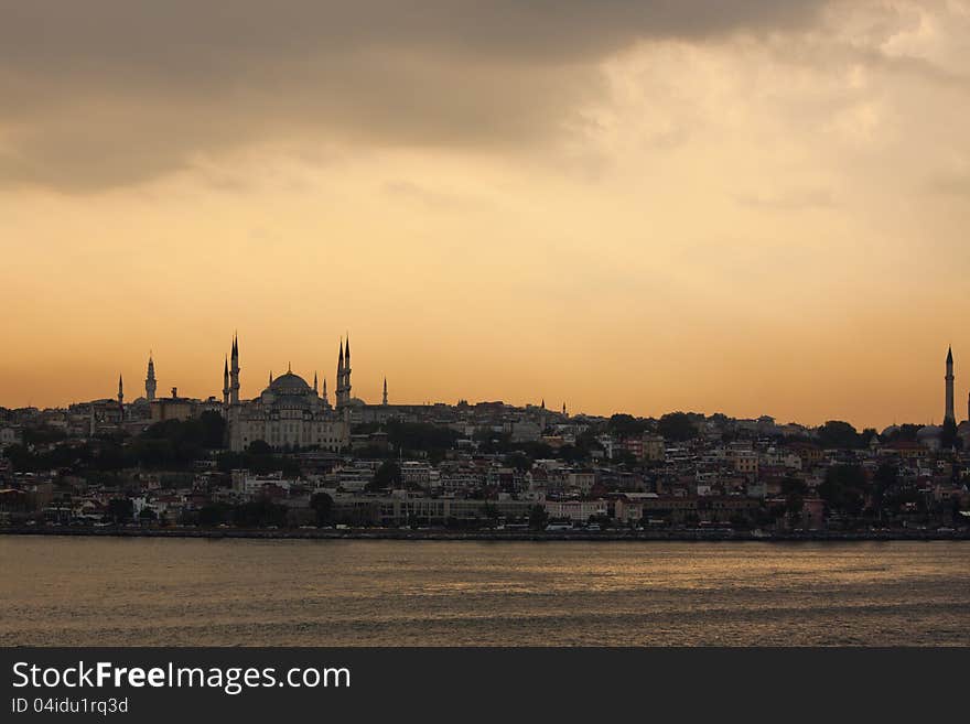 Istanbul and the Blue Mosque seen from the sea at sunset. Istanbul and the Blue Mosque seen from the sea at sunset.