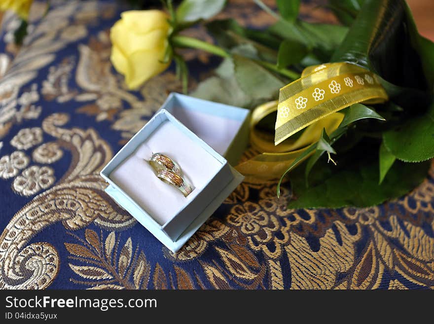 Wedding rings and flowers landscape