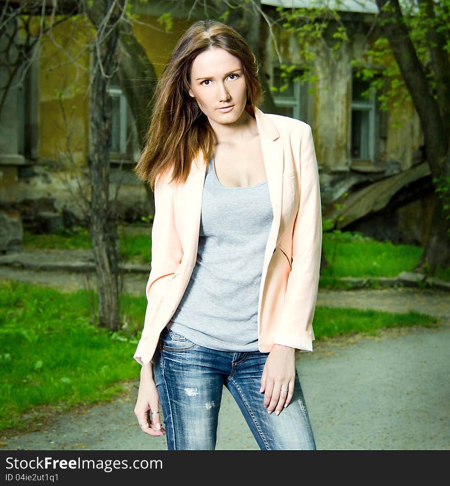 Fashion portrait of beautiful woman posing on old school background