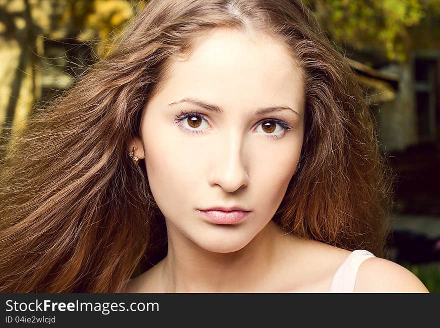 Fashion portrait of beautiful woman posing on bright background